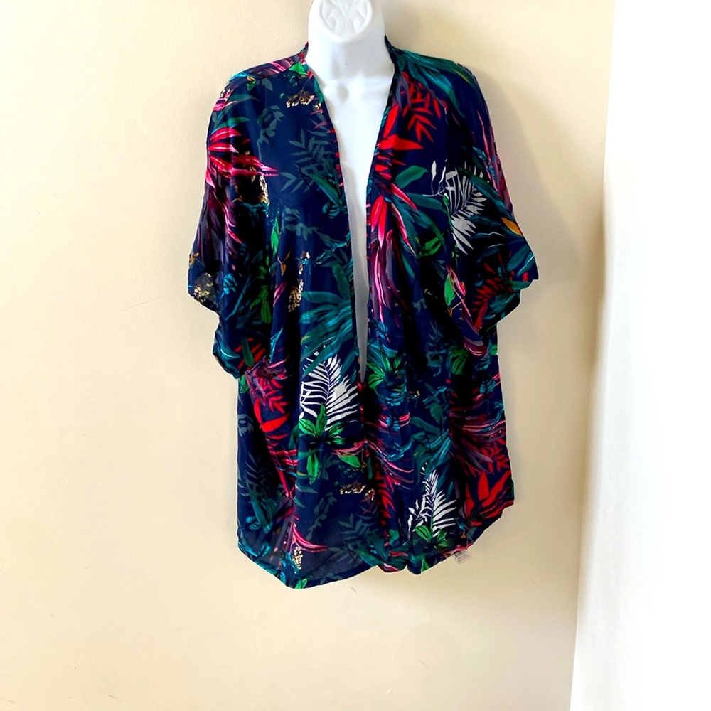 Wrap with sleeves. Lightweight. New with tag. Polyester.